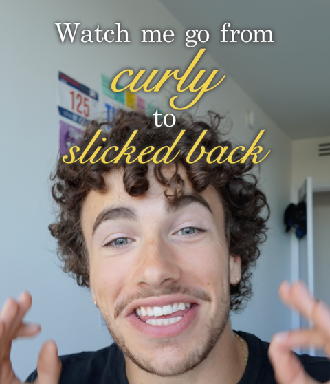 Smiling young man with curly hair and piercings, text overlay: Watch me go from curly to slicked back