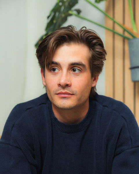 Man looking away from camera with bro flow hairstyle