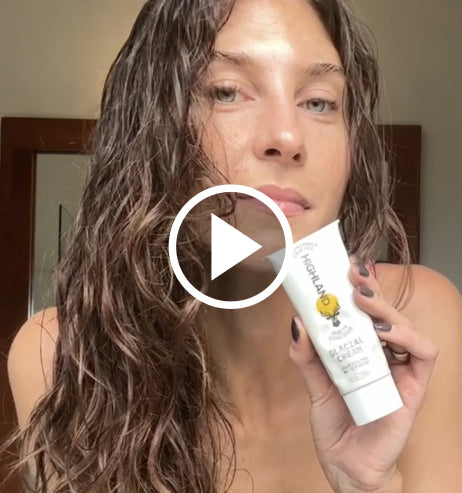 Woman holding tube of Highland Glacial Cream