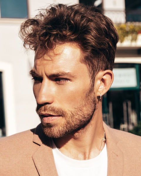 Side profile of man with textured fringe haircut