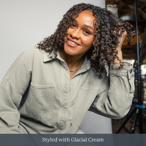 Smiling woman with curly hair — Styled with Glacial Cream