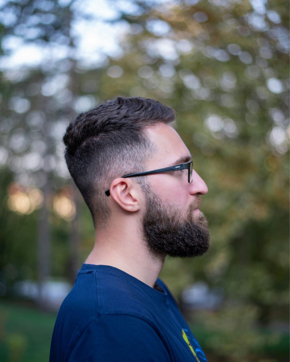 A man with a subtle low taper fade