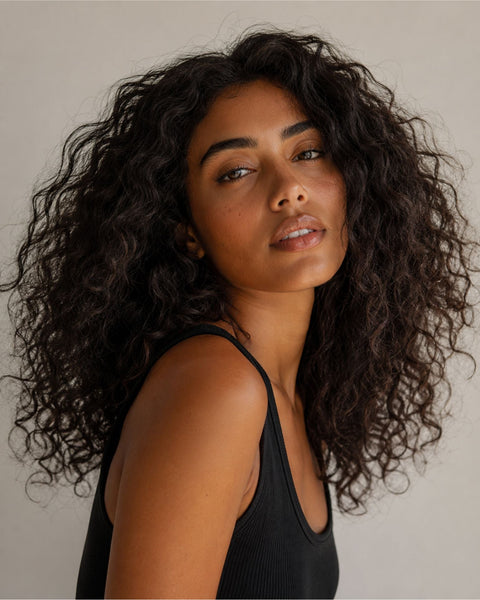 Woman with coarse hair looking at camera
