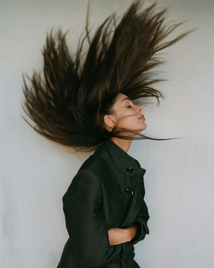 woman flipping her fine hair