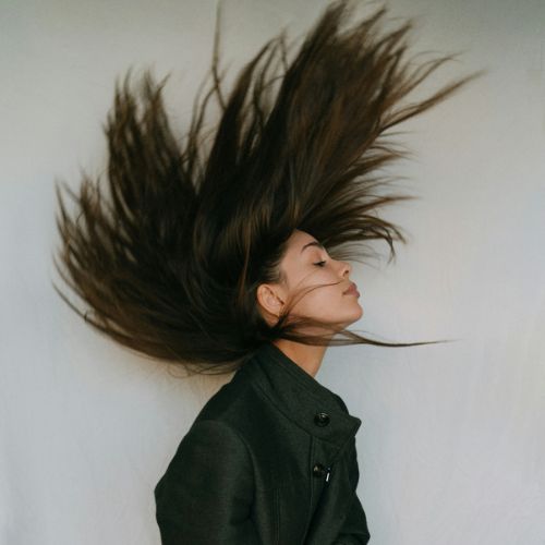 woman flipping her fine hair