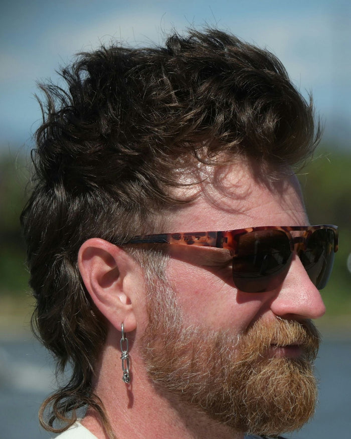 Side profile of man with an old school mullet