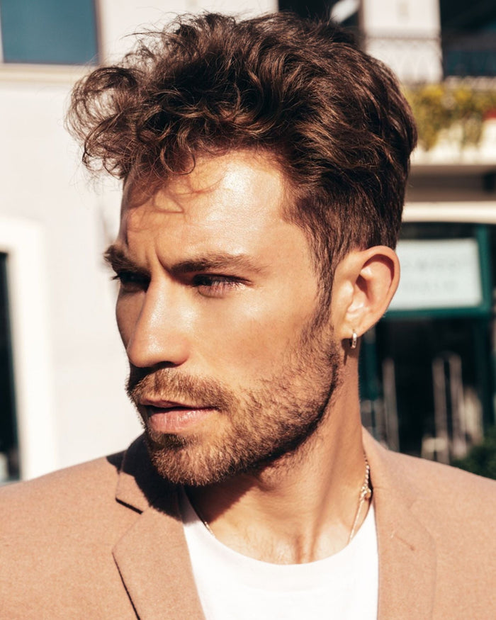 Side profile of man with textured fringe haircut