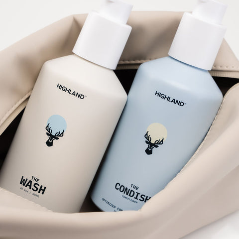 Top view of Highland Dopp Kit showcasing its cream interior, with The Wash and The Condish bottles shown inside