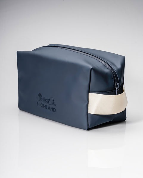 Front three quarter view of the Slate Highland Dopp Kit showcasing its zipper and carry handle against a white background