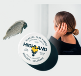Jar labeled HIGHLAND GLACIAL CLAY COLORADO, clay smear, and a woman touching her hair in the background.